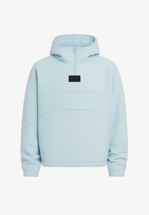 Heledsinine kapuutsiga särk, millel on pool-zipp disain, valmistatud pehmest kangast, ning sellel on rinnal must ristküliku kujuline logo.