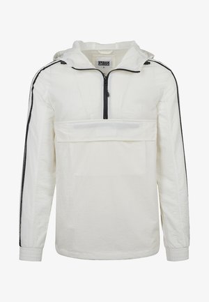 Veste pullover blanche avec une fermeture éclair à l'avant, capuche ajustable et rayures noires sur les côtés. Comprend une poche avant avec un panneau transparent et des poignets élastiques.
