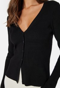 Bubbleroom KNITTED TRUMPET SLEEVE CARDIGAN - Kardigan - black