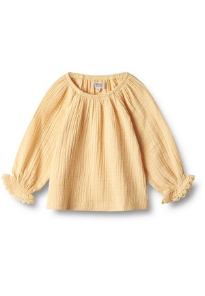Lysegul langærmet babybluse med rynket halsudskæring, tekstureret stof og elastiske manchetter med blonder, lagt fladt på hvid baggrund.