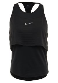 Sort Nike træningstanktop med et lagdelt design, der har en ribbet tekstur på det øverste lag og et glat nederste lag. Sølvfarvet logo-accents.