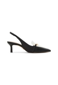 Black and white slingback shoe with pointed toe, slender heel, smooth leather texture, gold hardware accent near the toe.