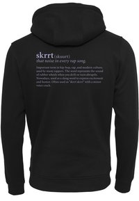 Black hoodie with a textured finish, featuring purple text on the back. The design includes definitions and explanations of the slang term "skrrt."