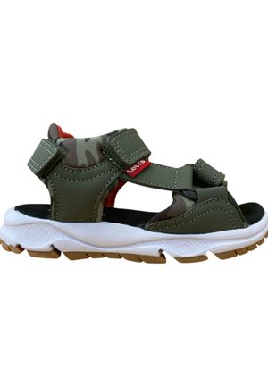 Sandalias de color verde oliva con correas de Velcro, suela acolchada, entresuela blanca texturizada y suela de goma. Presentan un forro interior de camuflaje.