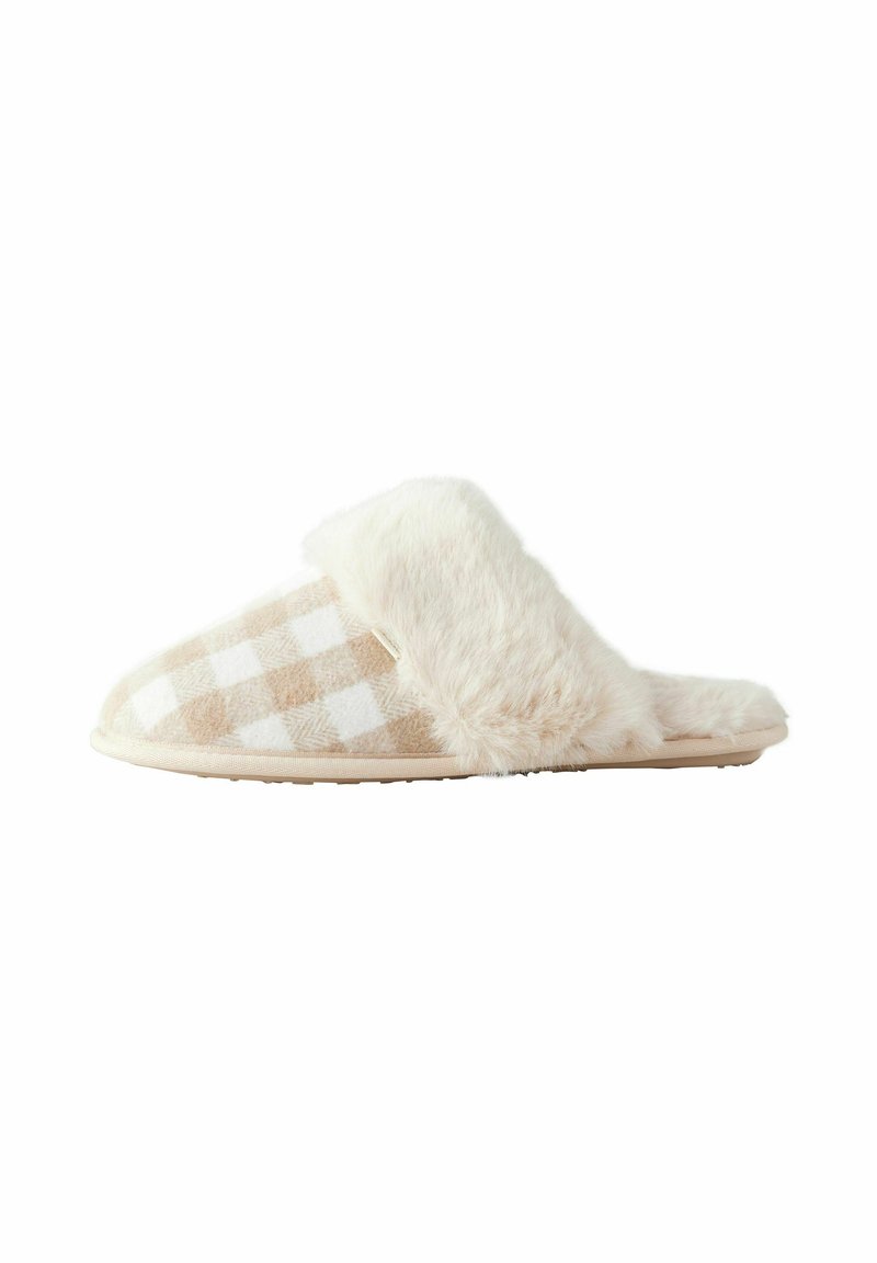 Tossu kirkasta ja valkoista ruudullista kangasta, jossa on pörröinen kerma trimmi, muotoiltu muoto ja teksturoitu pohja. Pehmeä materiaali, avoin takaosa.