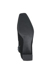 Botte de cheville en daim noir avec une semelle en caoutchouc texturé et un talon bloc, marquée à la taille 37. Conçue pour la stabilité et l'adhérence.
