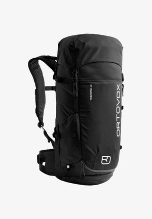 Schwarzer Nylon-Rucksack mit gepolsterten Mesh-Trägern, seitlichen Taschen, Oberverschluss und weißen Logodetails. Entwickelt für Outdoor-Aktivitäten.