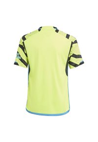Jersey amarillo brillante de manga corta con rayas negras y patrones de puntos; cuenta con acentos azules y un cuello acanalado. Tejido suave y transpirable.