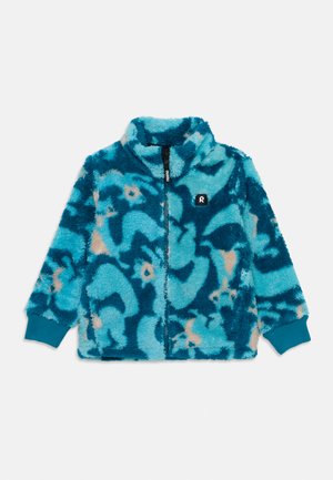Veste bleue floue avec un motif abstrait en bleu clair et beige. Dispose d'une fermeture éclair sur le devant, d'un col montant et de poignets côtelés. Vignette de logo sur la poitrine.