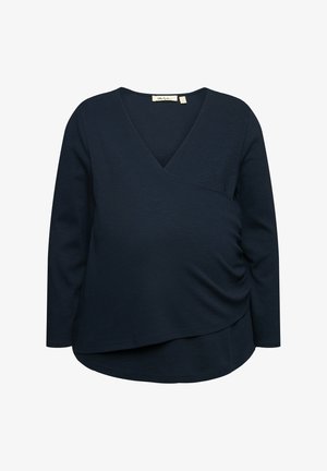 Námořnický modrý top s dlouhým rukávem, v dekoltu do V a s překříženým designem. Obsahuje na bocích nařasené detaily pro přiléhavý siluetu. Měkčí textura.