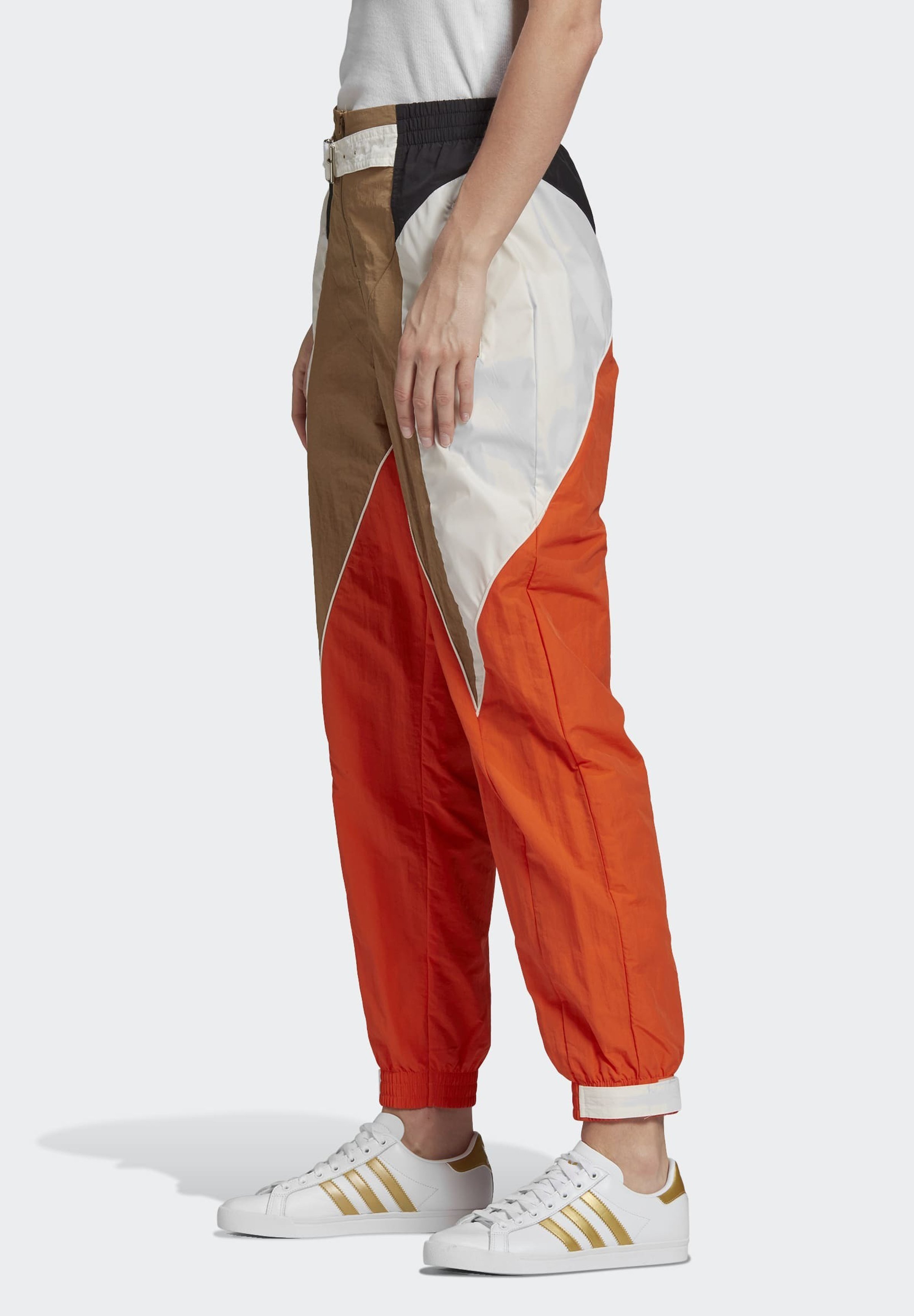orange and white adidas tracksuit