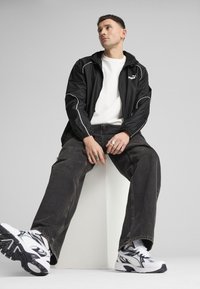 Puma SPORT  - Windbreakers - black