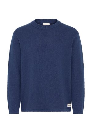 Marineblå langermet strikkegenser med rund hals og liten hvit stoffetikett nær nederste kant på høyre side.