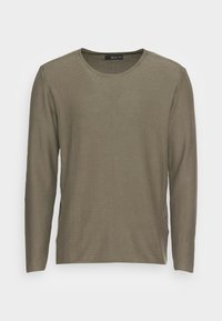 Chemise à manches longues vert olive en tissu texturé, dotée d'un col rond et d'empiècements latéraux, au design simple et minimaliste.