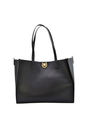 Sac tote en cuir noir avec deux longues poignées, un accent en métal doré à l'avant et des coutures visibles le long des bords latéraux.