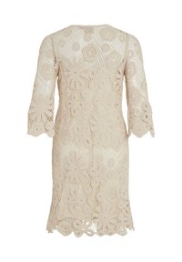 Robe au crochet couleur crème, longueur au genou, motifs floraux et manches trois-quarts, vue de dos.