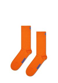 Calcetines de algodón naranja con corte tipo crew, presentan un puño acanalado y el texto azul "HAPPY" en un lado. Textura suave con un diseño de color sólido.