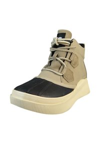 Beige and black high-top sneaker featuring a textured black front with hexagonal accents and cream rubber sole, tied with thick laces.