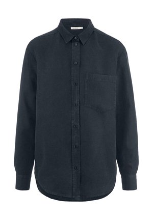 Camicia nera con bottoni, maniche lunghe, colletto e taschino frontale. Realizzata in tessuto morbido con una finitura leggermente strutturata.