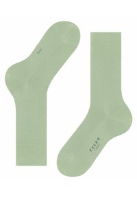Calzini alla caviglia verde chiaro con polsino a coste, texture liscia, punta e tallone rinforzati. Nome del marchio stampato "FALKE" sulla suola.