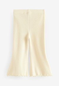 Pantaloni flared a coste di colore crema con un dettaglio di orlo scallop, caratterizzati da una texture morbida e una vita aderente.