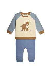 Completo in cotone per bambini con felpa beige chiaro che presenta un motivo di mucca marrone e maniche blu, abbinato a pantaloni blu.