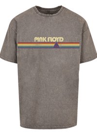 Gray cotton t-shirt featuring "PINK FLOYD" text in yellow above a multi-colored striped design with a purple triangle.