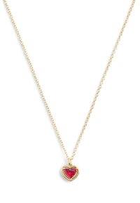 Gold chain necklace featuring a heart-shaped red gemstone pendant, highlighted by a polished metal bezel. Simple and elegant design.