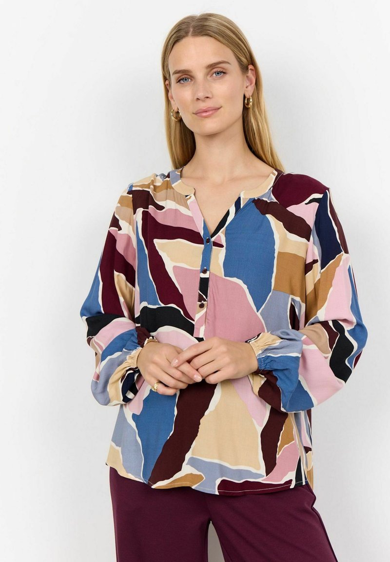Multicolored button-up blouse in soft fabric. Features abstract patterns in pink, blue, beige, and burgundy. Long sleeves with elastic cuffs.