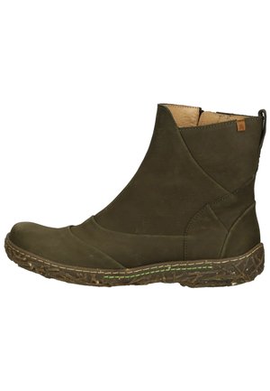 Olive green leather ankle boot with a textured finish, curved design, and a brown patterned sole featuring green stitching accents.