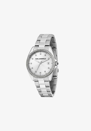 Silberner Metallarmbanduhr mit rundem Zifferblatt, mit Edelsteinen besetzter Lünette, weißem Zifferblatt und silbernen Gliedern am Band. Verfügt über ein Datumsdisplay und ein Logo.