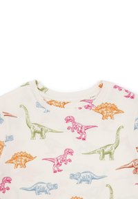 Puuvillane T-särk ümarate krae, kreemjas taust, millel on värvilised dinosauruse illustratsioonid roosa, rohelise, sinise ja oranži värviga.