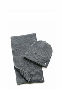 Gray knitted beanie with a folded cuff and matching scarf. Both feature ribbed texture and small logo accents on the ends.