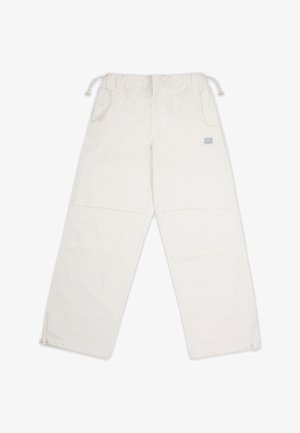 Valged püksid elastse vöökohtaga, kahe küljetasku ja lukuga allservas. Valmistatud siledast kangast, millel on minimaalne toestus.