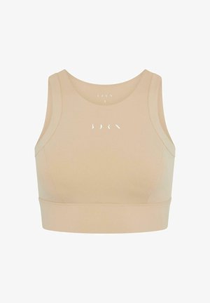 Beżowy stanik sportowy z okrągłym dekoltem, szerokimi ramiączkami i elastycznym paskiem na dole. Posiada minimalistyczny tekst na przodzie.