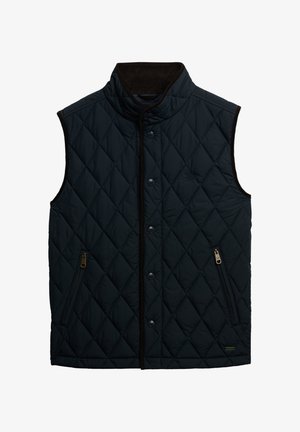 Gequilted zwarte vest met hoge kraag, ritszakken aan de zijkant, drukknoopsluitingen en contrasterende bruine afwerking. Lichtgewicht en een zachte textuur.