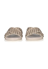 Beige slide sandals with cross straps, adorned with metallic studs, featuring a smooth footbed and white rubber outsole.