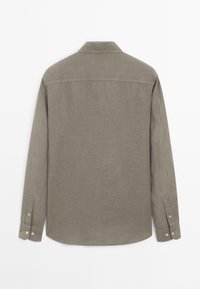 Long-sleeve shirt in muted gray fabric. Features a pointed collar, button-down cuffs, and a straight hemline with a smooth texture.