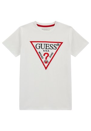 Biała bawełniana koszulka, krótki rękaw, okrągły dekolt, z czerwono obramowanym trójkątem i czarnym napisem "GUESS U.S.A. WASHED JEANS" oraz znakiem zapytania.