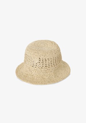 Beige Häkel-Bucket-Hut mit breiter Krempe, der ein offenes Webmuster und eine strukturierte Oberfläche aufweist. Geeignet für warmes Wetter.