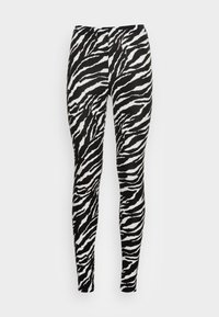 Collant a righe zebra in bianco e nero con design aderente e texture morbida, dotati di una vita alta e finitura liscia.