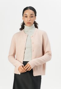 Pink wool blend cardigan with a round neckline, long sleeves, button closure, and ribbed cuffs, layered over a striped turtleneck top.