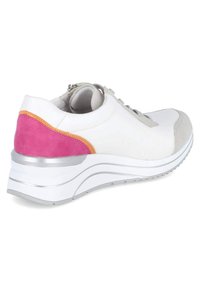 White sneaker with a pink, orange, and grey suede accent. Features a thick, cushioned sole with silver accents and a lace-up front design.
