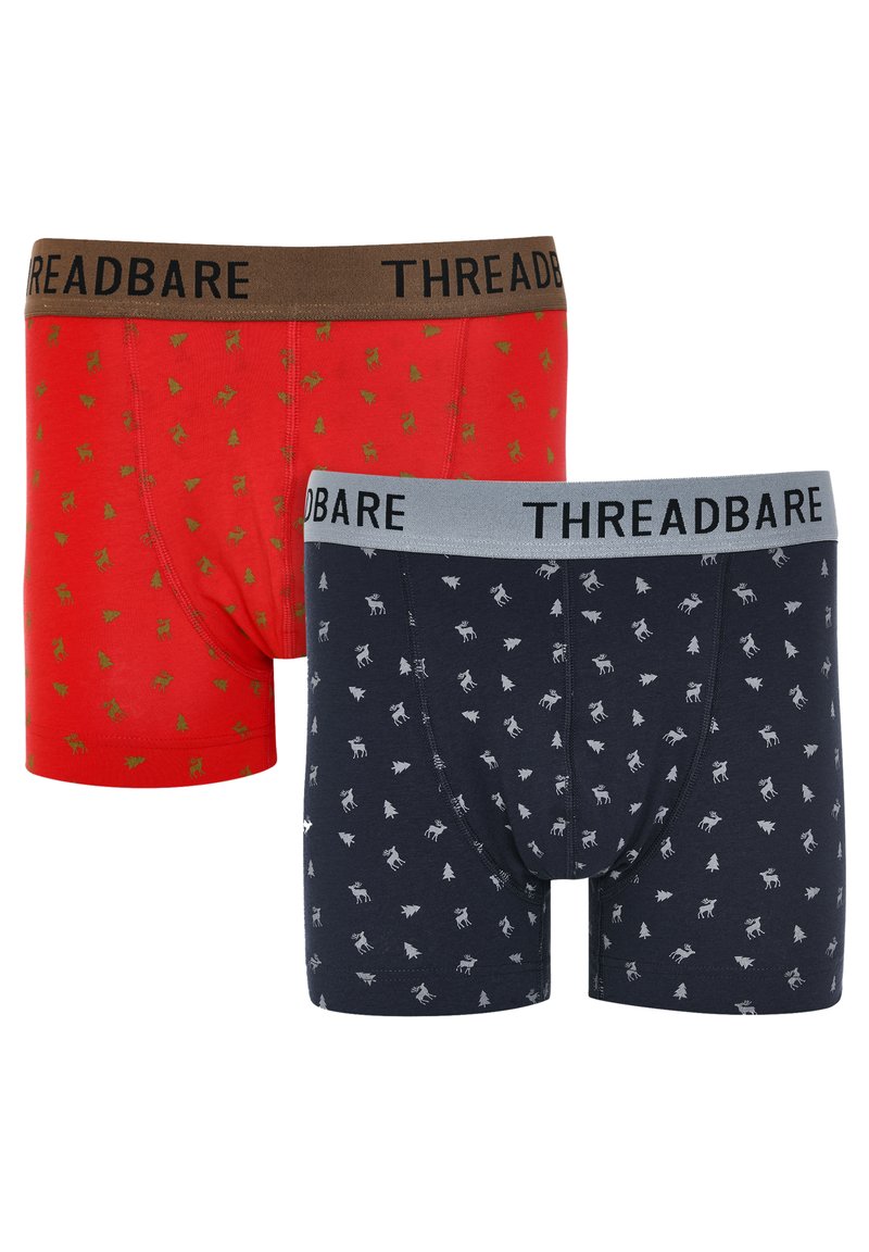 Röda och marinblå boxershorts med gröna och vita mönster med julgran och renar. Elastiska midjeband i brunt och grått.