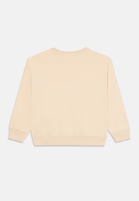 Felpa in cotone beige con collo rotondo, maniche lunghe e polsini a coste. Texture liscia, colore uniforme, progettata per un abbigliamento casual.