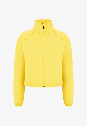 Veste courte jaune à manches longues avec col montant, fermeture éclair devant et poignets élastiques, présentée sur fond blanc.