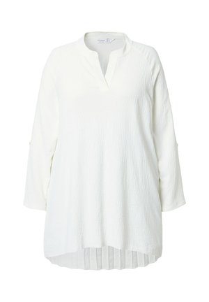 Valkoinen tunika, jossa on rento istuvuus, teksturoitu kangas ja v-muotoinen kaula-aukko. Siinä on pitkät hihat ja laskostettu helma lisäyksinä.