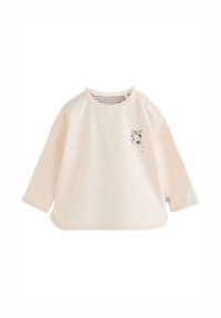 Cream-colored long-sleeve baby shirt with a small black and white milk carton graphic on the left chest and snap buttons on the shoulder.