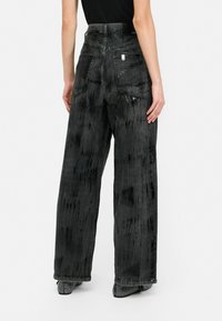 LIU JO MIT BESCHICHTUNG - Wide leg - black