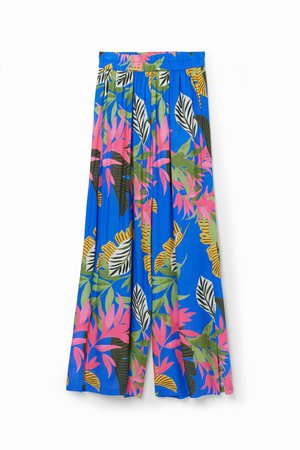 Pantalons larges bleus avec un motif de feuilles tropicales en rose, vert et noir. Taille élastique avec plis pour plus de volume.